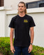 Black tshirt with yellow embroidered design