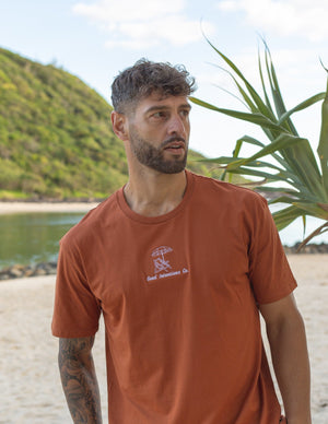 Rust coloured tshirt with white embroidered design