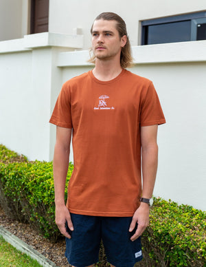 Rust coloured t-shirt with white embroidered design